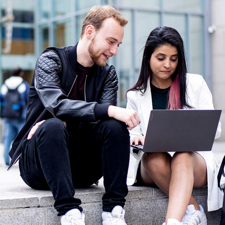 NCI students reviewing timetables on a laptop